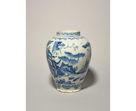 A delftware vase, 18th century, the ovoid form painted in the Chinese manner with two figures carrying vases beneath pine and