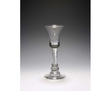 A composite stem wine glass, c.1750, the bell bowl raised on an airtwist stem over annulated collars and a beaded knop, over 