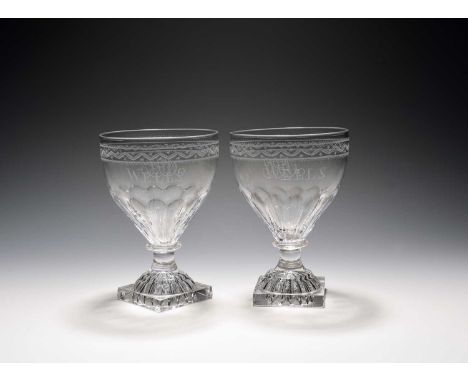 A pair of glass rummers, 19th century, the round funnel bowls engraved 'WELLS' and with monogrammed initials 'MJC', above mou