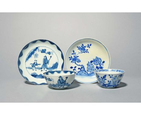 Two Bow blue and white teabowls and saucers, c.1750-60, one painted in a bright blue with flowering peony branches issuing fr