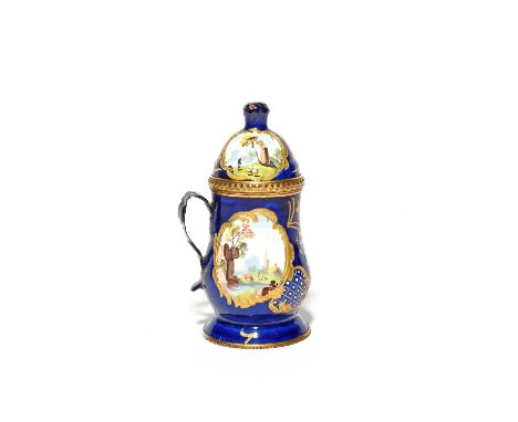 A Staffordshire enamel mustard pot and cover, c.1780, the baluster form painted with panels of shepherds tending their flock 