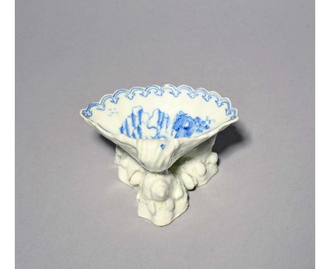 An early Bow blue and white shell salt, c.1750, the deep shell salt painted in a bright blue with a gnarled willow tree besid