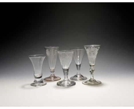 A dwarf ale glass and four other glasses, c.1740-80, the ale engraved with hops and barley over a short balustroid stem, a dr