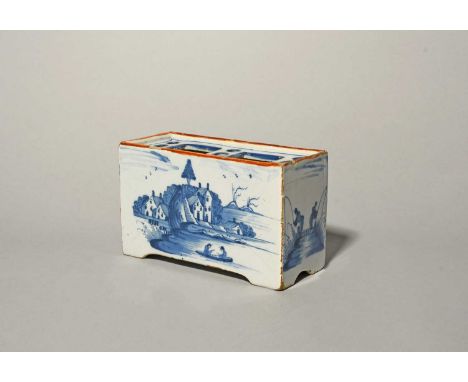 A Bristol delftware flower brick, c.1760, the rectangular form painted to the long sides with two figures in a boat before bu