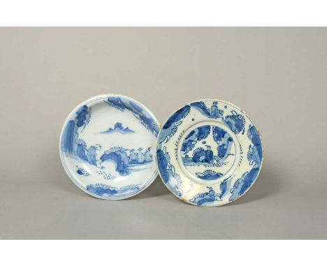 Two early delftware dishes, c.1680-1700, variously painted in blue with differing Chinese figures seated in a garden landscap