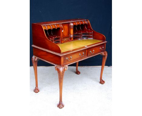 Chippendale style mahogany desk, the gadrooned rectangular top with tooled skiver mounted by a gallery fitted with drawers an