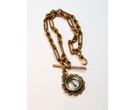 9ct gold watch guard of fetter and triple knot pattern, Birmingham 1919, with compass, gross 41g.