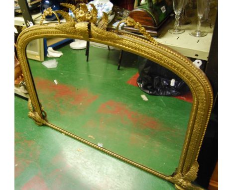 19th century giltwood overmantel mirror mounted by fern finial, egg and dart and floral arched frame enclosing glass plate, 1