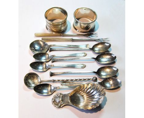 Silver scallop caddy spoon, two napkin rings and various other silver items.