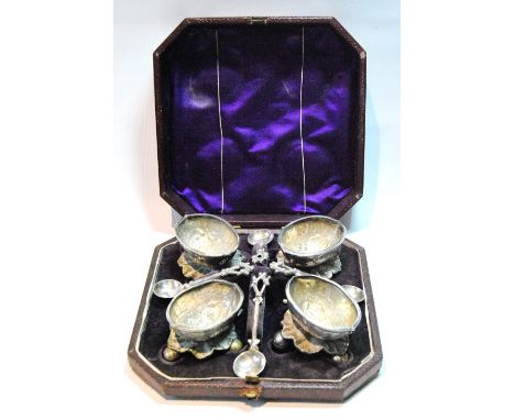 Unusual set of four EP salts modelled as half walnut shells upon leaves, on ball feet, with spoons, cased, c. 1880.