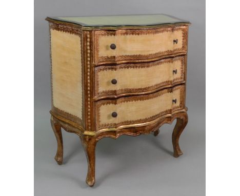 A reproduction mid 18th century style Florentine giltwood and painted petit commode, of serpentine outline, fitted with three