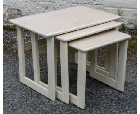 A nest of three G-Plan light oak coffee tables, 67cm wide x 43cm deep x 49cm high.