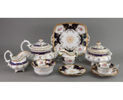 A Coalport thirty eight piece tea service, painted with bouquets of flowers reserved within cobalt blue borders foliate gilde