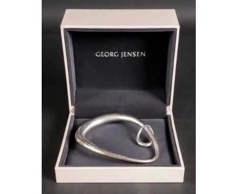 Georg Jensen; a Danish silver Offspring collection bangle with charm, English Import marks, modern, shape no. 433L, 8.5cm wid