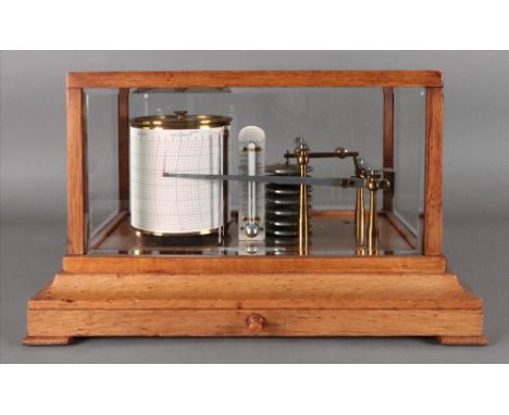 Negretti &amp; Zambra London; a light oak cased barograph, with 7-tier vacuum, a chart drawer below, 36cm wide x 22cm deep x 