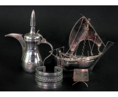 A model of a sailing boat, apparently unmarked, 17cm across, a cuff bangle, detailed 925, with wirework decoration and a Quat