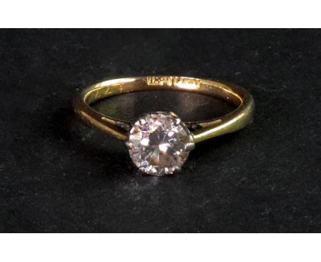 A single stone diamond ring, the brilliant cut diamond, approximately 0.80ct, claw set to an 18ct gold and platinum mount, ri