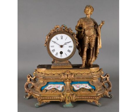 A French gilt speltar mantel timepiece, circa 1880, the drum cased movement flanked by a standing figure, the base inset with
