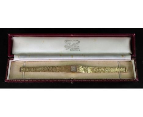 Bueche-Girod: a lady’s 9ct gold wristwatch, the silvered square dial with gilt metal baton indicators, to a manual wind movem