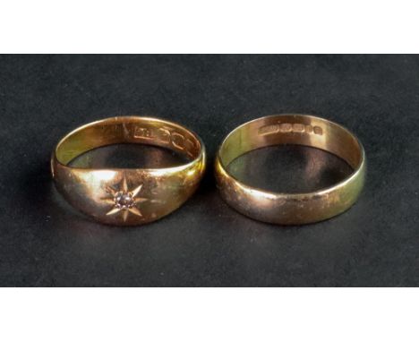 An 18ct gold band ring, ring size M; and another tapered band ring set with a diamond, marks rubbed, ring size N, 7.1g gross 