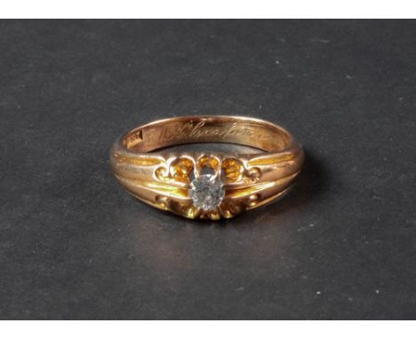 An 18ct gold and diamond-set dress ring, of tapered design, the old mine-cut diamond claw set to a pierced and scroll mount, 