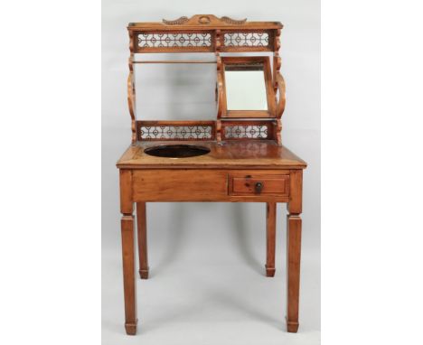 A Chinese hardwood washstand, 20th century, the back with mirror and towel rail, the top with cut-out for a basin, a drawer u