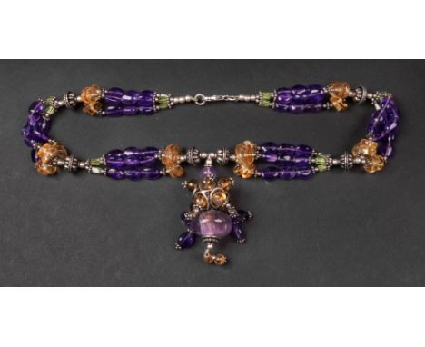 A silver, amethyst, citrine and peridot bead pendant necklace, composed of three strands of beads, united by silver bead link