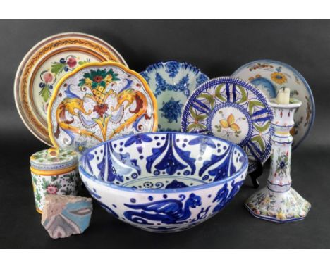 A collection of Spanish, Italian and Portuguese faience and maiolica, including a candlestick, jar and cover, bowls and dishe