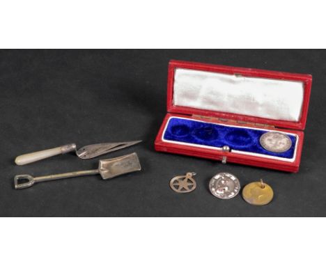 A Queen Victoria silver Maundy four pence 1887, a gilt tooled red leather Maundy money case, an Edwardian silver novelty trow