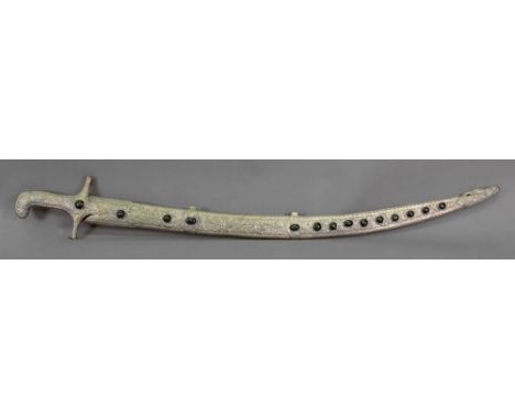An Islamic silvered metal sword grip and scabbard, foliate embossed within gadroon borders and set with fourteen cat's eye ca