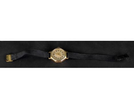 An 18ct gold cased octagonal wristwatch, the silvered dial with applied gilt metal Arabic numbers, to a manual wind movement;