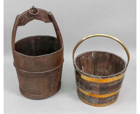 A brass bound oak bucket, 20th century, with swing handle, 34cm diameter and an oak well bucket, with iron ring handle, 66cm 