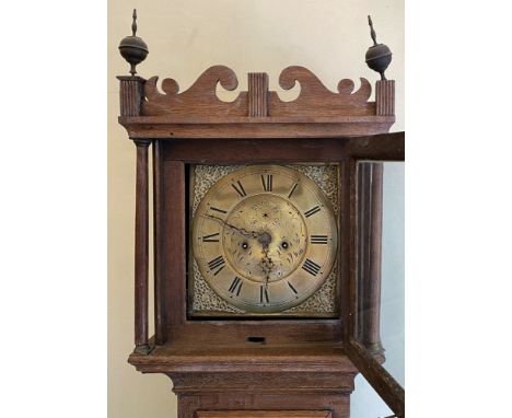 A. Molinare Halesworth; a George III oak longcase clock, the square hood with brass orb finials and freestanding columns, pan