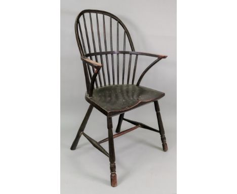 An ash and elm comb back Windsor elbow chair, first half 19th century.