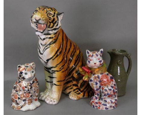 A large Italian ceramic figure of a tiger, 20th century, 60cm high, a studio pottery pitcher, 29cm high and two modern Imari 