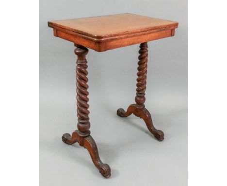 A Victorian light oak games table, the hinged swivel fold-over top, on spiral end standards with carved downswept legs, 56cm 