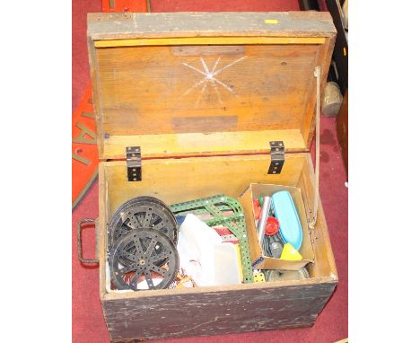 A pine trunk containing a collection of Meccano