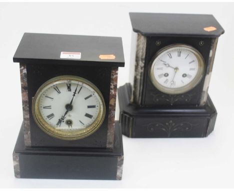 A late Victorian black slate and rouge marble cased mantel clock, having a circular enamel dial with Roman numerals, the 30-h