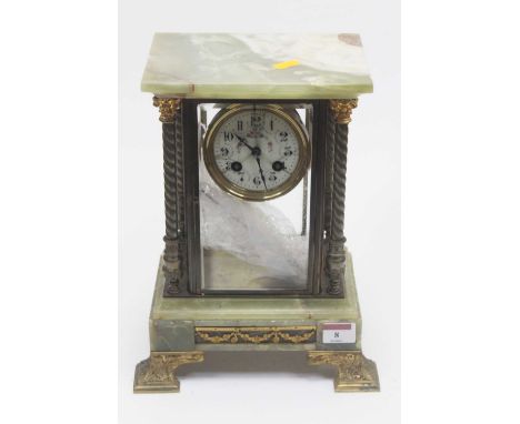 A 19th century onyx and gilt metal mounted four glass mantel clock having a circular enamel dial with Arabic numerals and eig