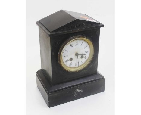 A late Victorian black slate cased mantel clock, of architectural form, having a circular enamelled dial with Roman numerals 