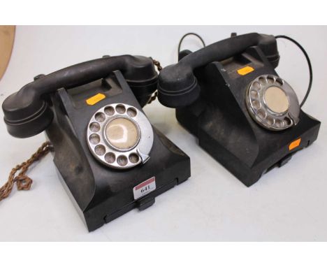 An early 20th century bakelite rotary telephone, together with one other similar