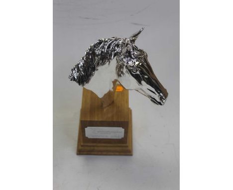 A modern horse-racing trophy, in the form of a chromed horse's head, on wooden plinth with plaque 'Wolverhampton Racecourse W