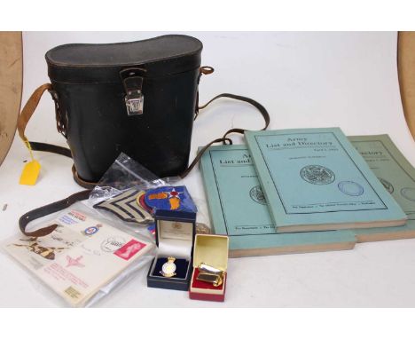 A collection of mixed militaria to include Hutchinsons Pictorial History of the War, canvas webbing, binoculars, first day co