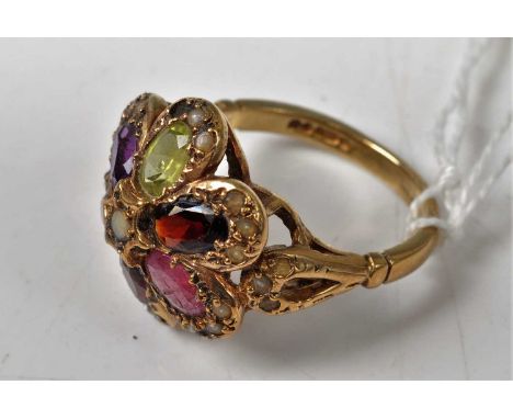 A 9ct gold multi-stone set flowerhead cluster ring, including amethyst, garnet, green peridot and seed pearl, 5.7g, size O/P 