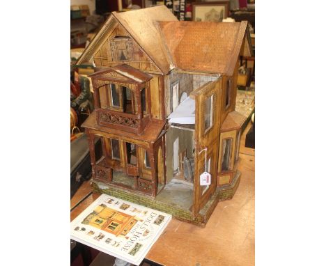 A Moritz Gottschalk German doll's house, circa 1890, the exterior having lithograph printed faux tile roof, with further lith