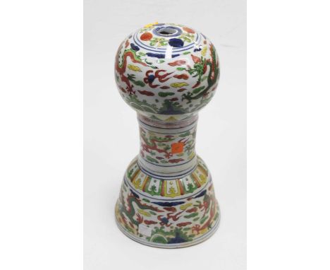 A modern Chinese hat stand having a globular top to tapered neck and domed base, enamel decorated with dragons chasing a pear