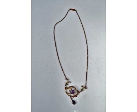 An Edwardian 15ct gold, amethyst and seed pearl set openwork pendant, on finelink neck chain, 6.4gCondition report: Central p