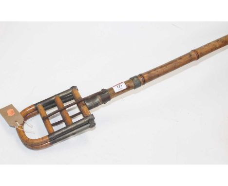 An early 20th century French bamboo and metal mounted shooting stick