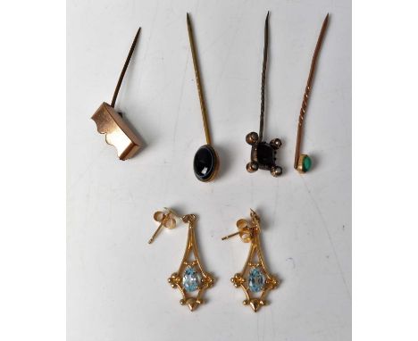 A yellow metal and turquoise set tie-pin; together with an agate set example; a gilt metal, amethyst and seed pearl set examp