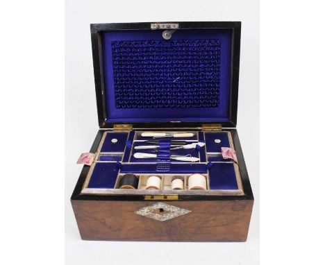 A Victorian figured walnut and mother of pearl inlaid dome topped work box, the hinged lid opening to reveal a silk lined int